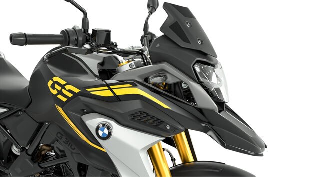 We see the side view of the front of the G 310 GS with a focus on the black tinted windscreen.. European Model Shown.