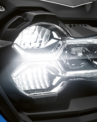 We see the front headlight of the R 1250 GS Adventure.