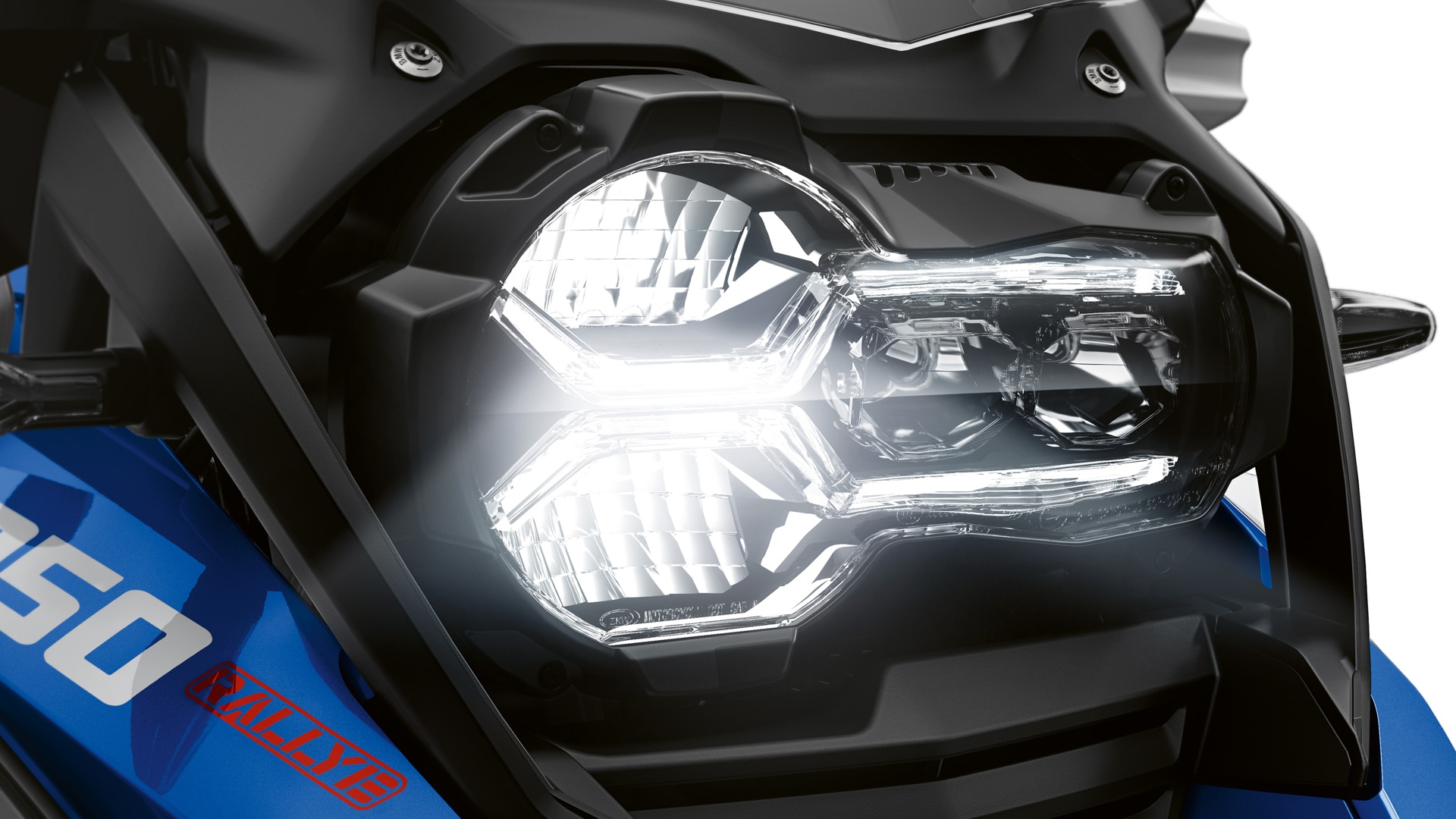 We see the front headlight of the R 1250 GS Adventure.