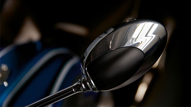 Chrome-plated mirror in typical oval shape.