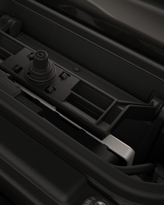 Integrated charging compartment with mobile phone.