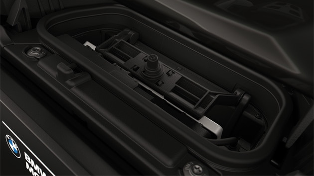 Integrated charging compartment with mobile phone.