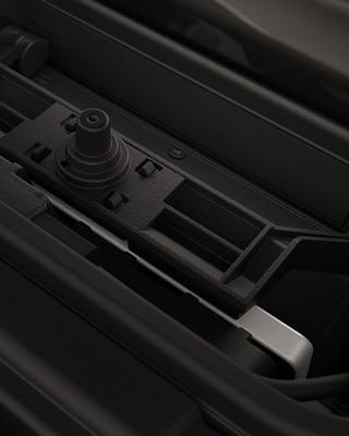 Integrated charging compartment with mobile phone.