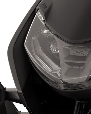 Front of the BMW CE 04 focusing on the LED headlights.